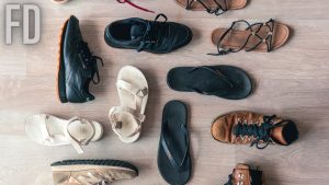 Assorted Shoes On Wooden Floor